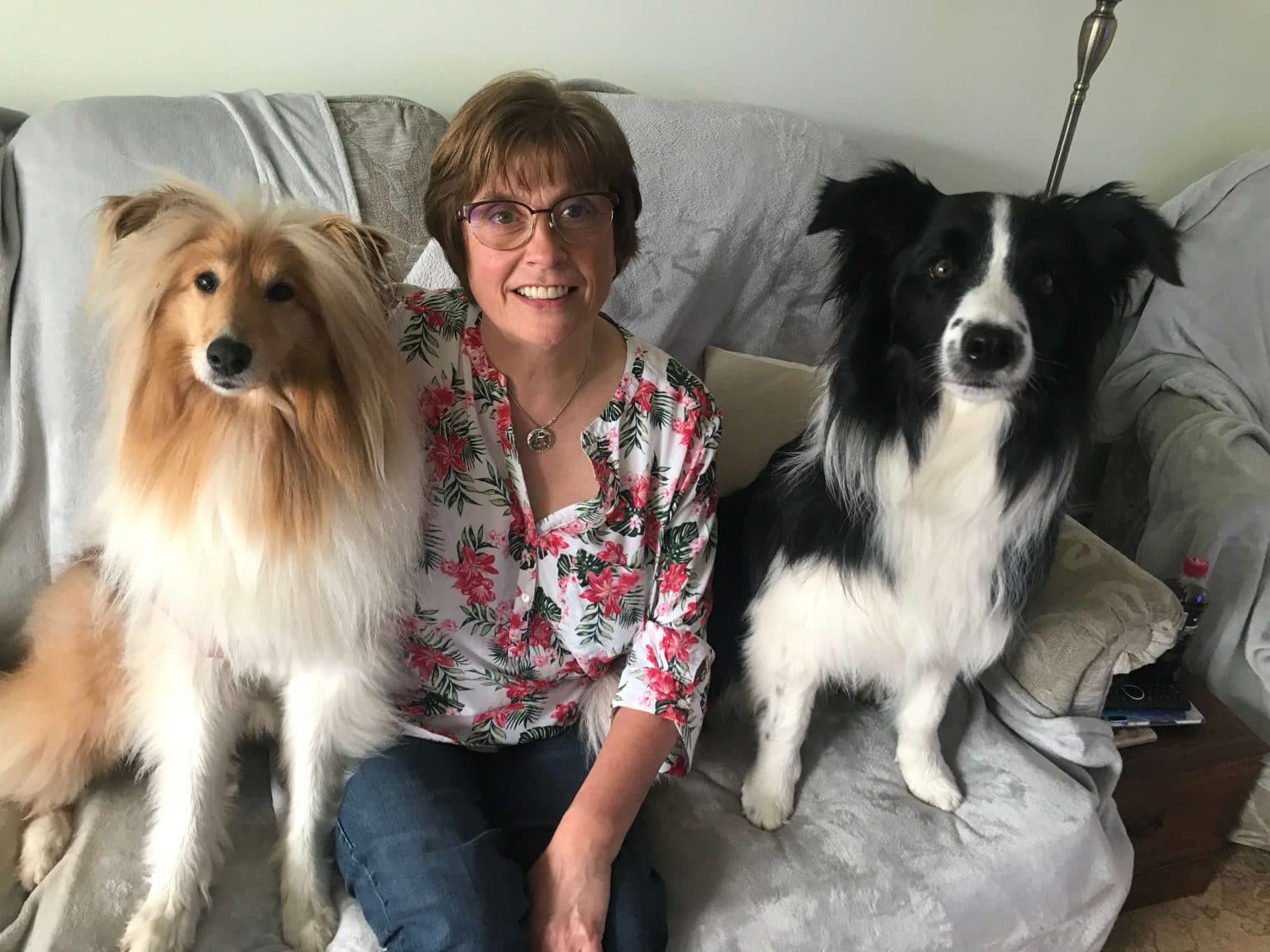 Coach Sandra with her 2 dogs smiling